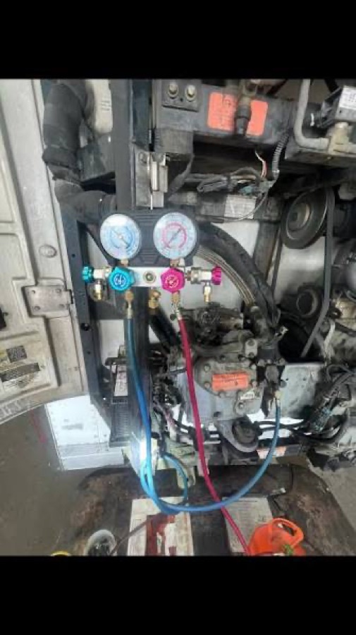 APU refrigerant gauges connected to a truck-side cooling system